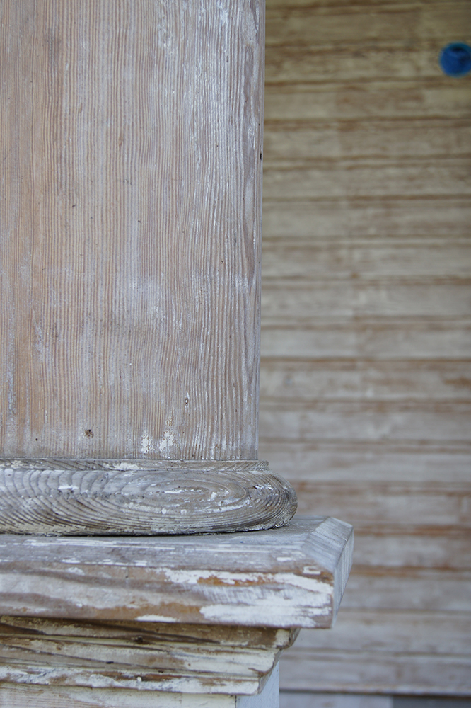 Close up shot of a column with paint removed.